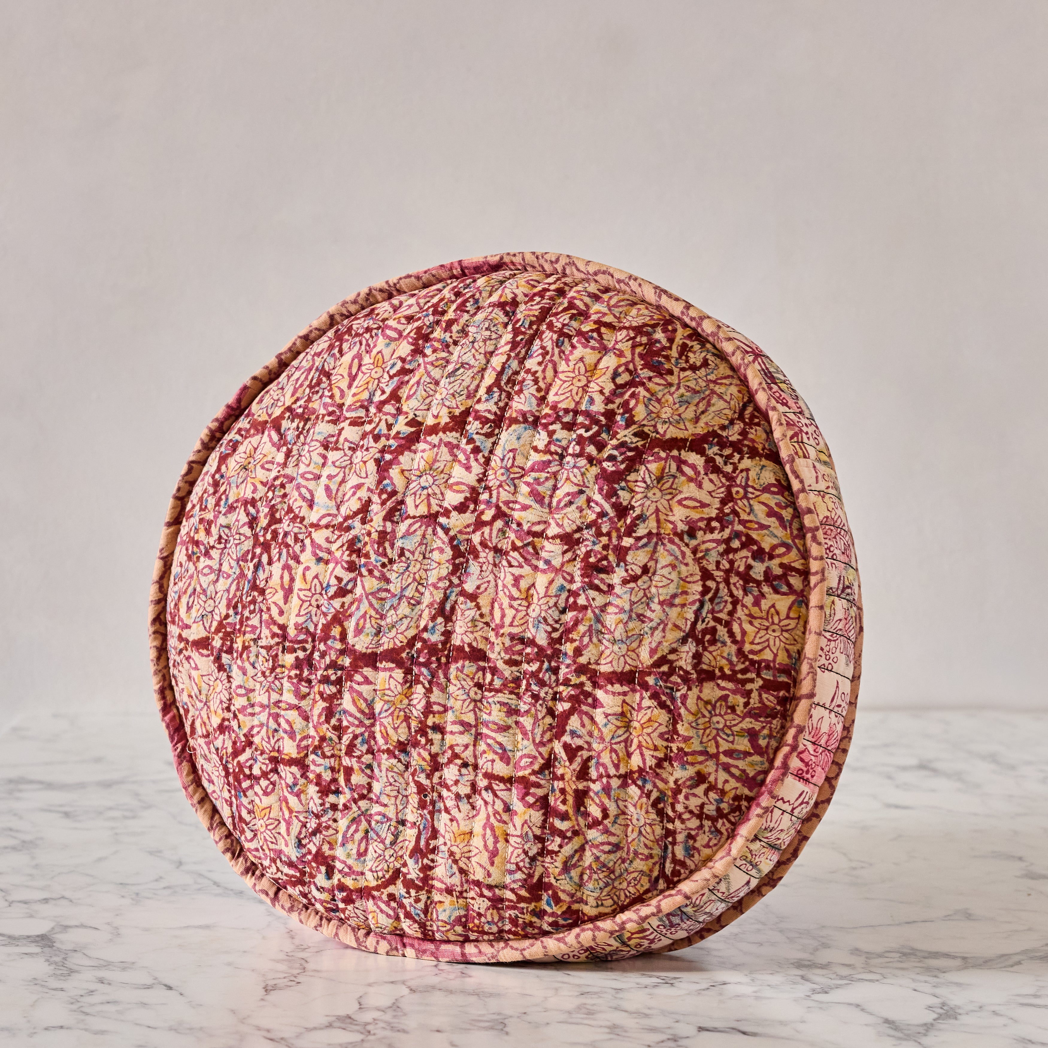 Hand-blocked Pillow in Berry Petals Party, Round